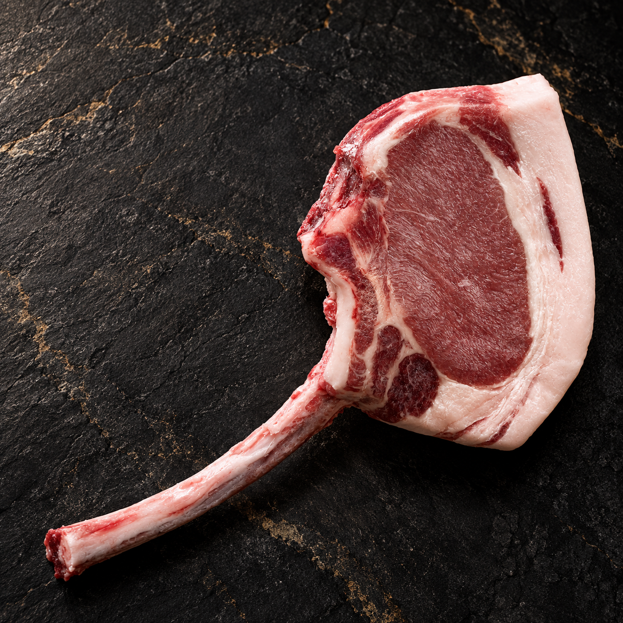 Raw whole Mangalitsa Tomahawk Pork Chop concept