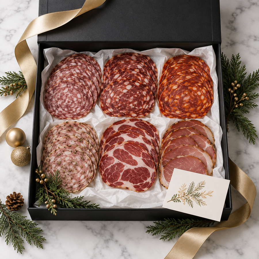 Holiday gift presentation: Six Cella's Reserve sliced charcuterie selections in a black gift box