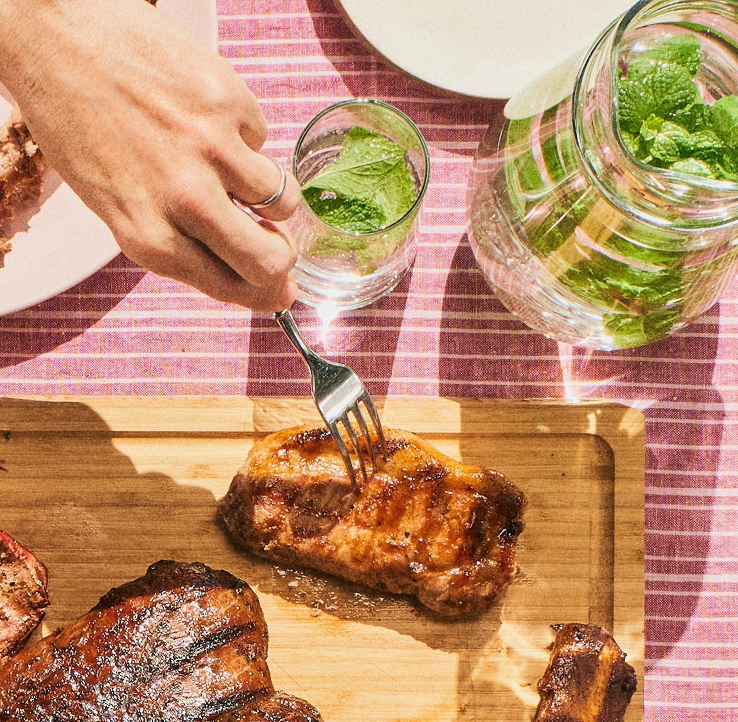 Cooked Mangalitsa pork steak served at the table