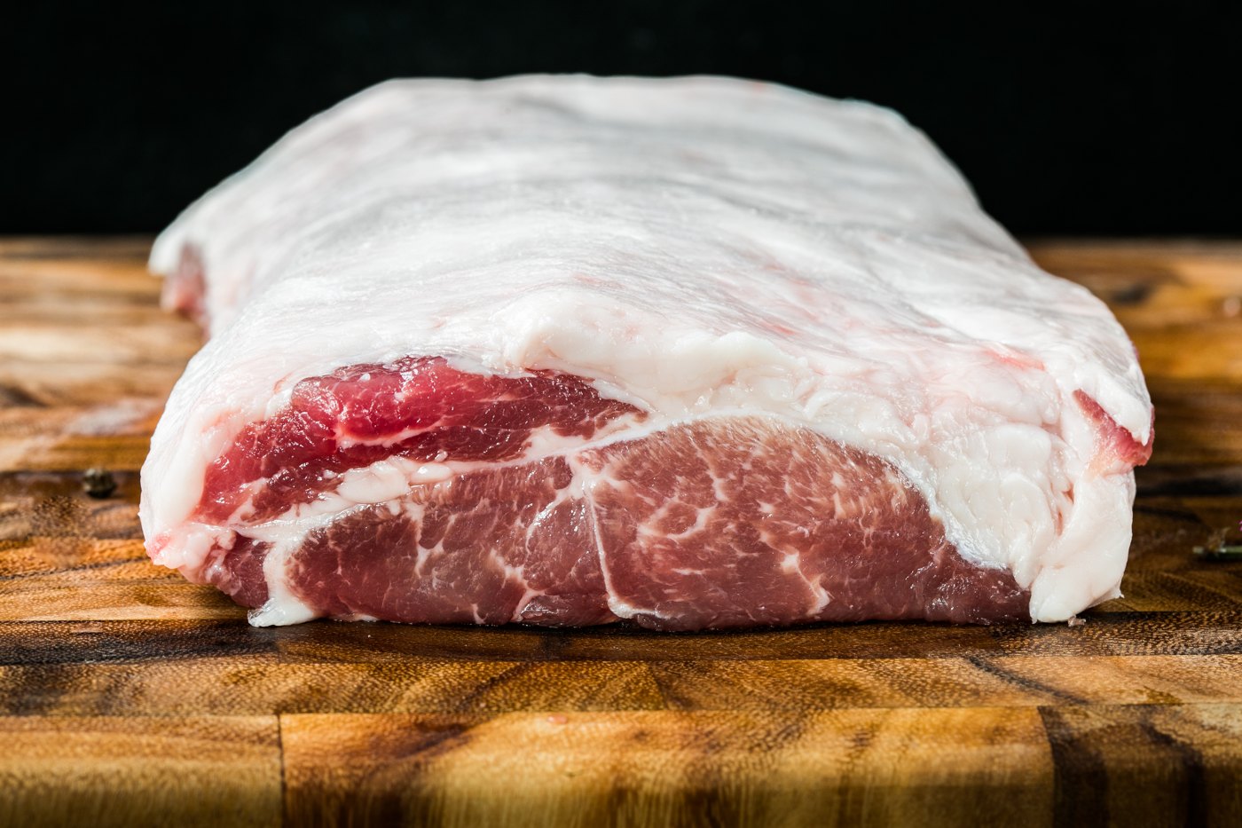 Deep red Mangalitsa pork with fine marbling and a generous fat cap